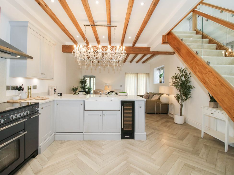 A kitchen with a stove and sink at The Hayloft in Birmingham