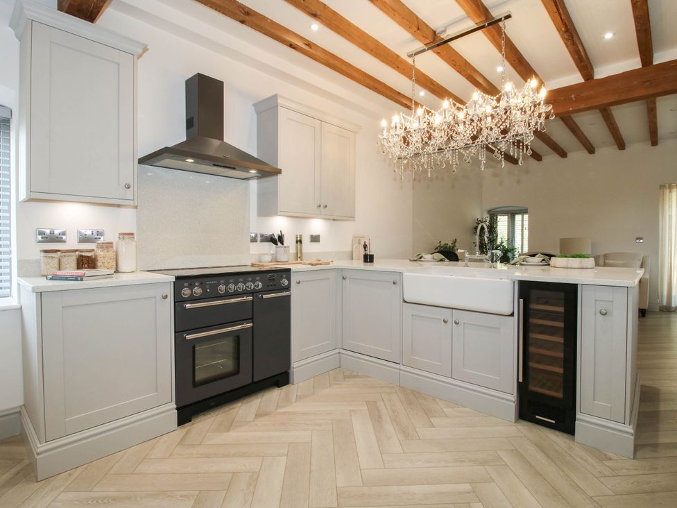 A kitchen with a grey cabinet and oven at The Hayloft in Birmingham
