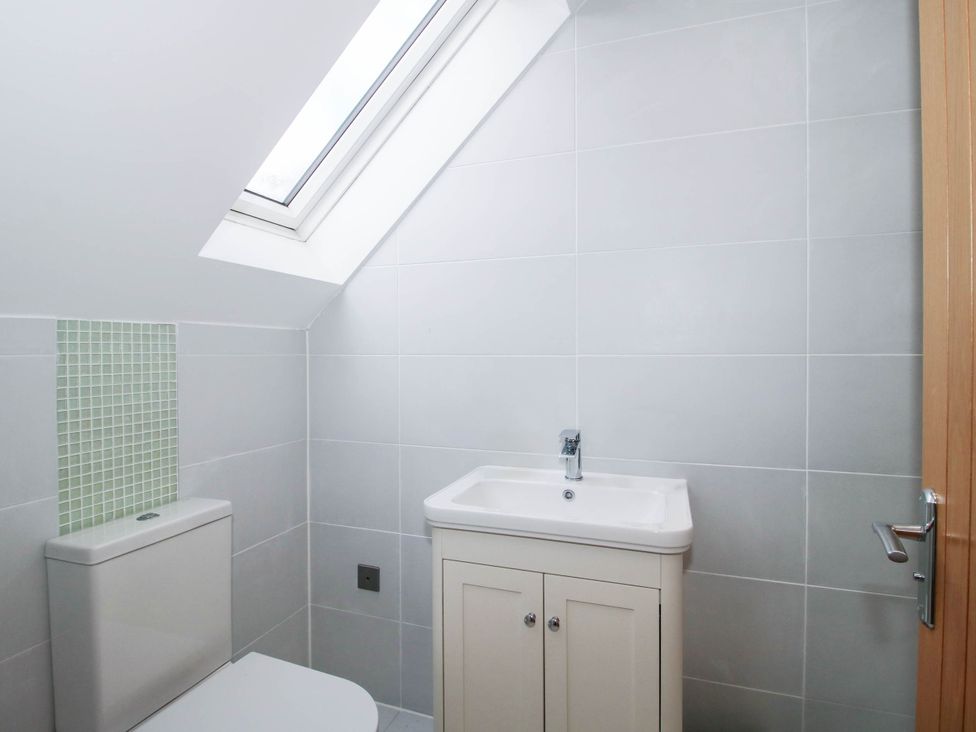 A bathroom with a toilet and sink at The Hayloft in Birmingham
