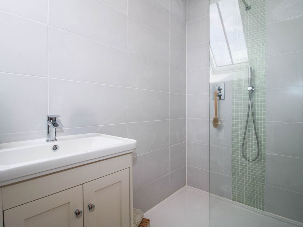 A bathroom with a sink and shower at The Hayloft in Birmingham