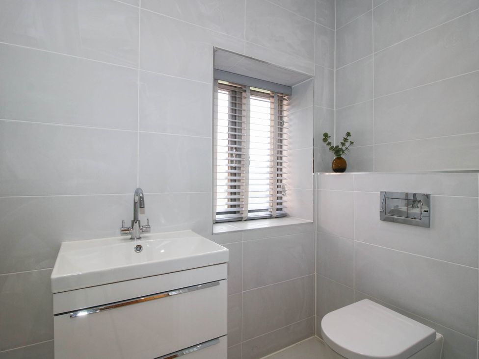 A bathroom with a sink and toilet at The Hayloft in Birmingham