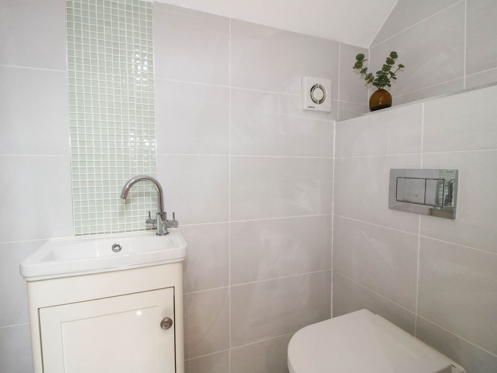 A bathroom with a toilet and sink at The Hayloft in Birmingham