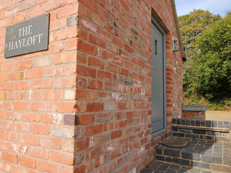 An entrance with a door and steps at The Hayloft in Birmingham