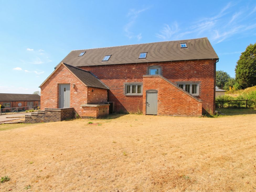 A brick building with stairs and windows at The Hayloft in Birmingham