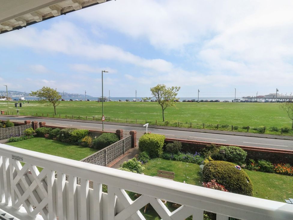 A view of the sea and grass from the balcony at Russell House in Paignton