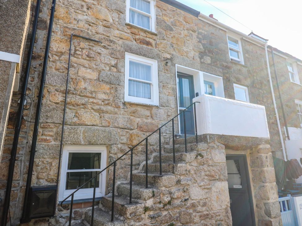 Exterior view of a building with stone walls and stairs at Top Deck St. Ives