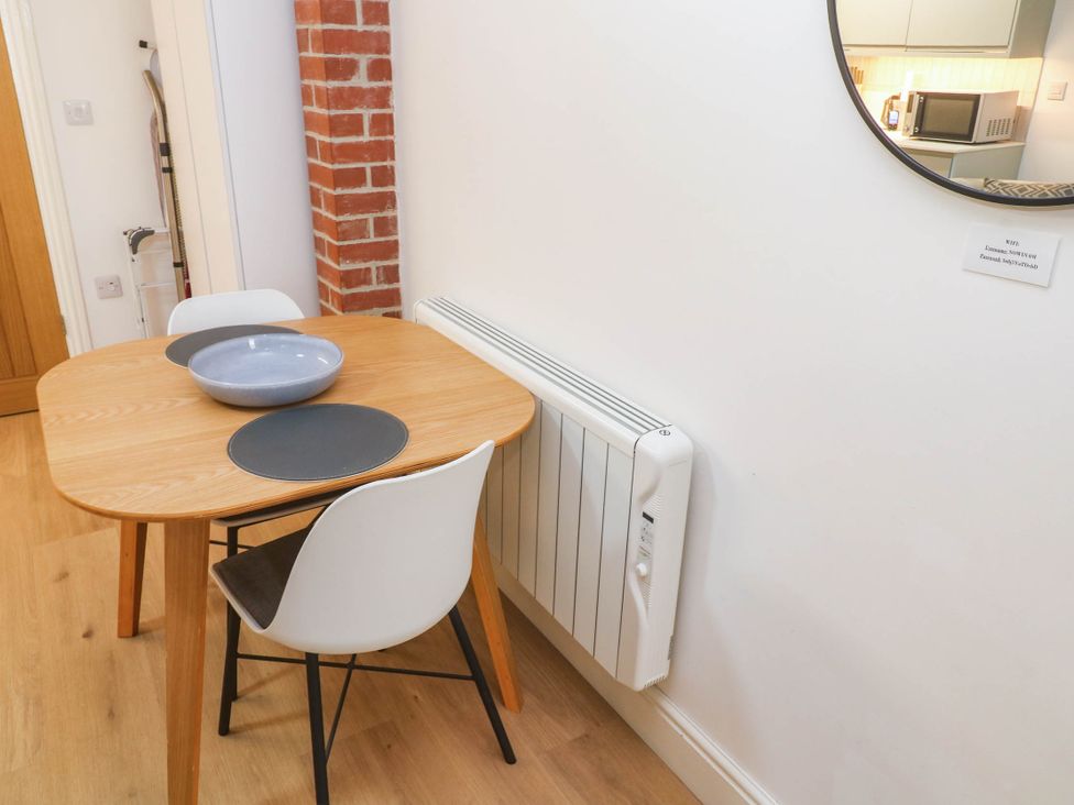 A dining room with a table and chairs at The Cabin in St Ives