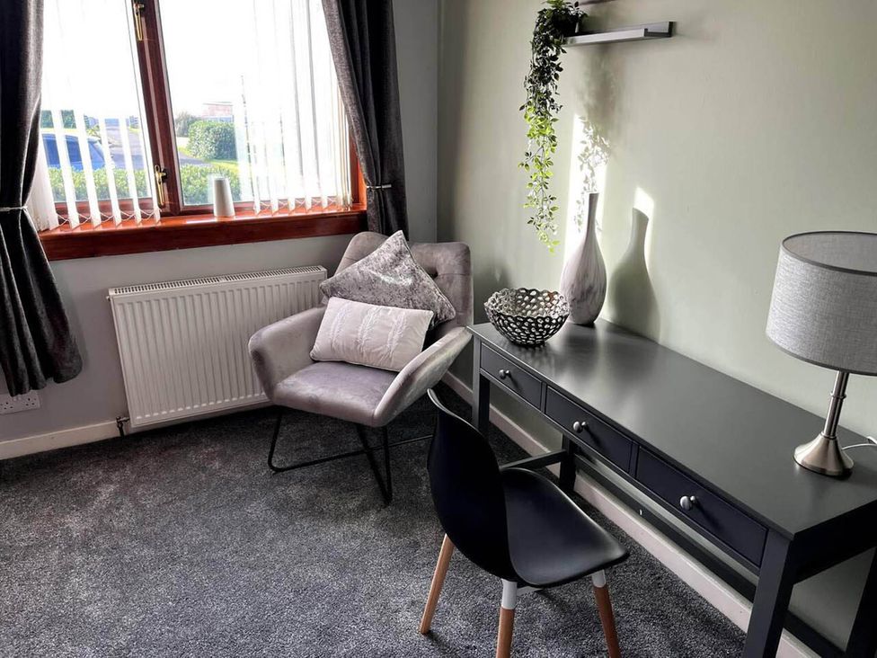 An office with a desk and chair at the property