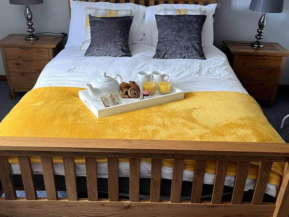 A bedroom with a bed and breakfast tray at the property in location