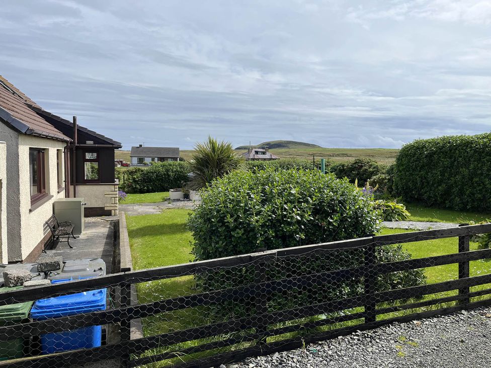 A house with a garden and fence at the property