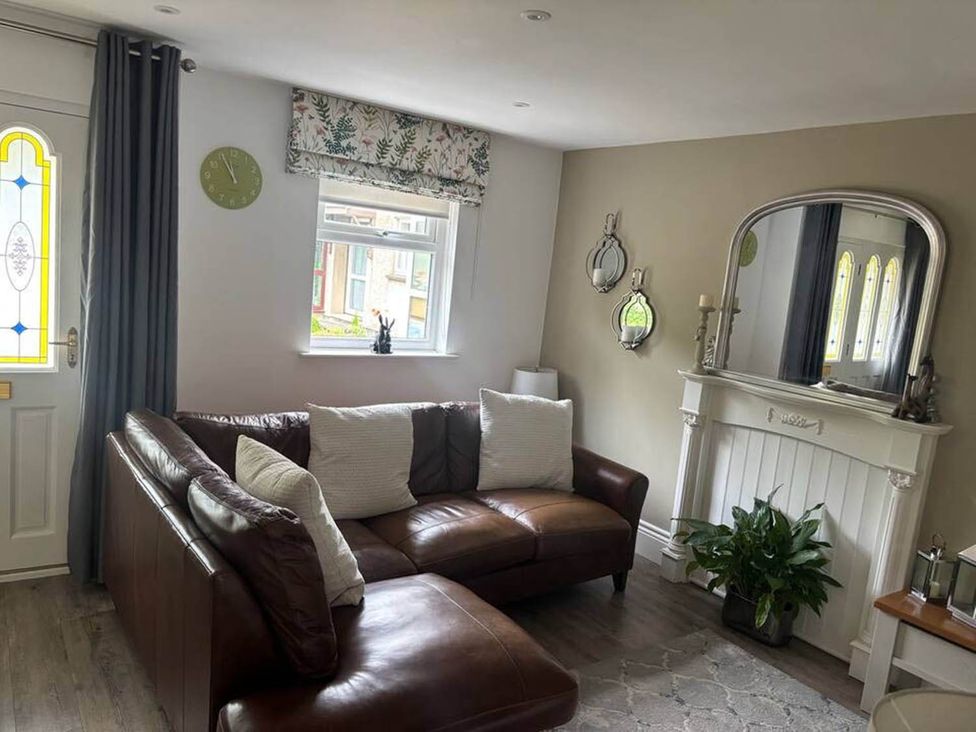 A living room with a sofa and a fireplace at 