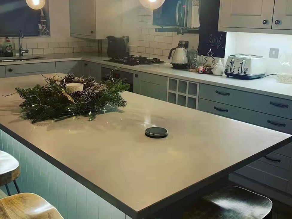A kitchen with a countertop and appliances at 