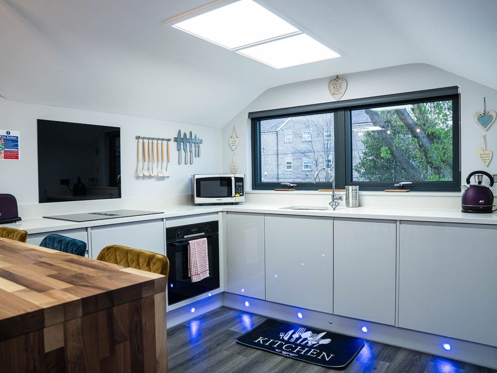 A kitchen with appliances and utensils at an unspecified location