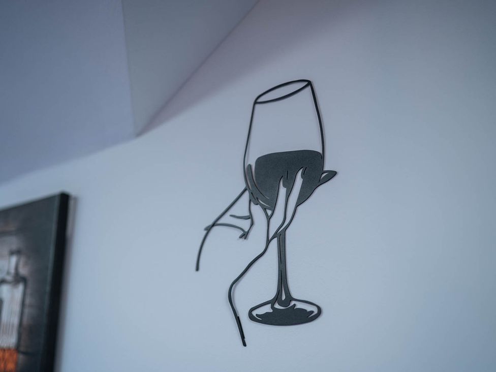 A wine glass wall art at an unspecified location