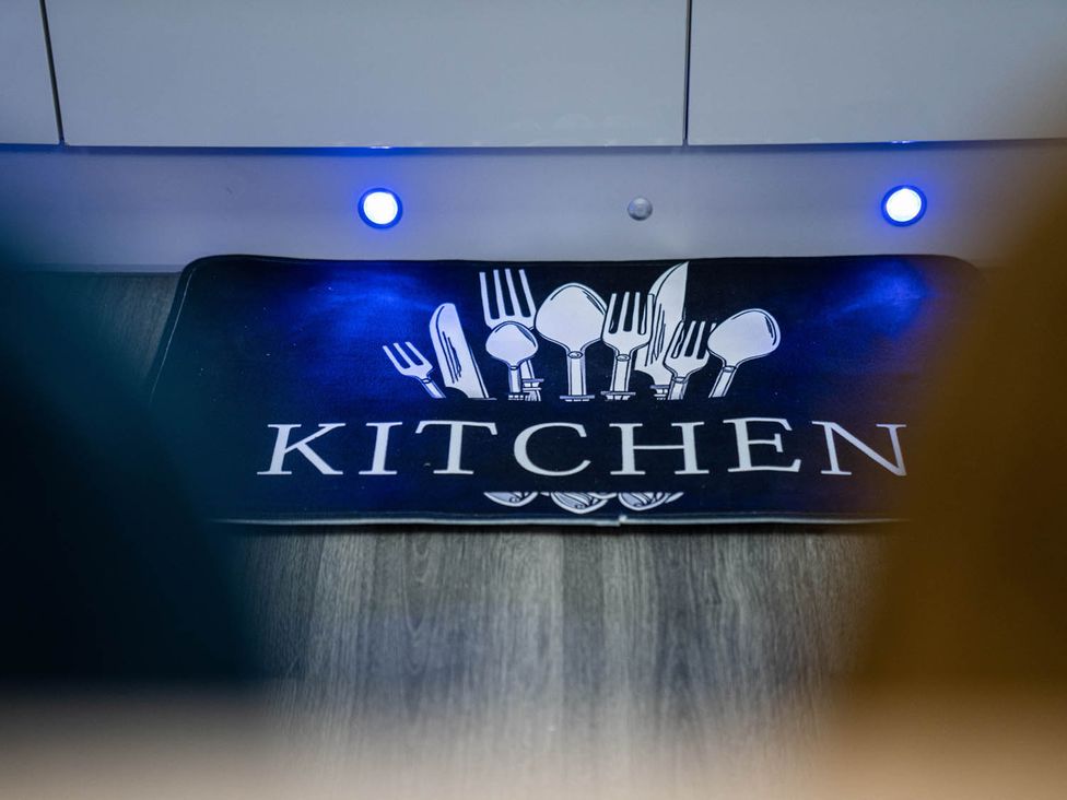 A kitchen mat with a cutlery design at the kitchen