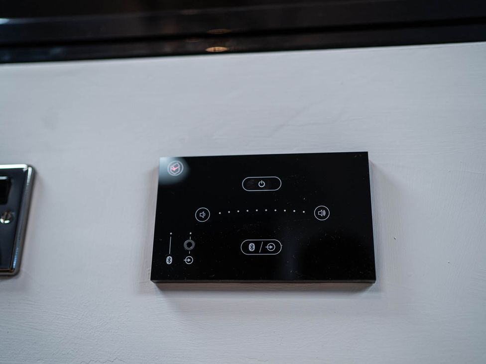 A control panel with buttons on a wall