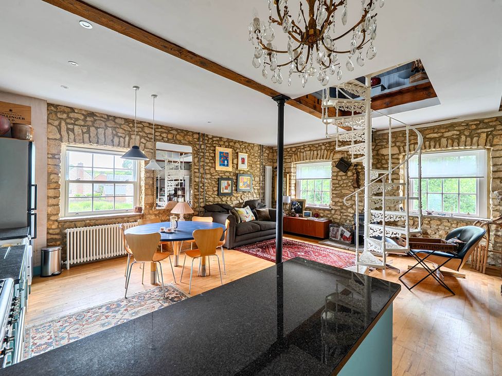 A living room with a sofa and coffee table at Beautiful Pad Near World Heritage Jurassic Coast Pymore near Bridport
