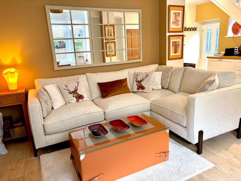 A living room with a sofa and coffee table at 5 Guests  2 Bedrooms  Free Parking 1min Beach Llandudno