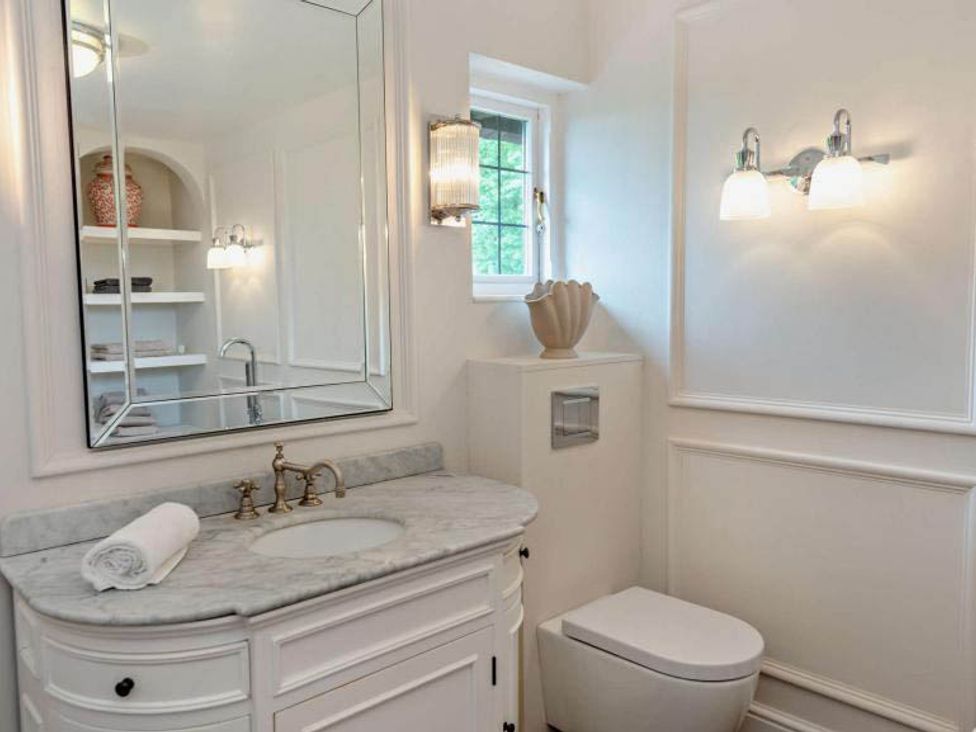 A bathroom with a sink and toilet at Luxurious 5 Bedroom House in Cookham near Marlow