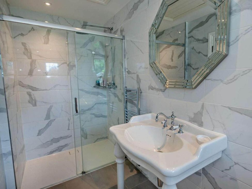 A bathroom with a shower and sink at Luxurious 5 Bedroom House in Cookham near Marlow
