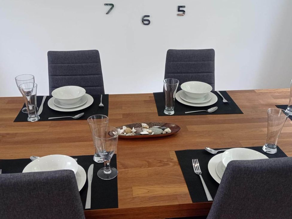 A dining room with a table set for four at RnB Rural n Beautiful near Barrhill