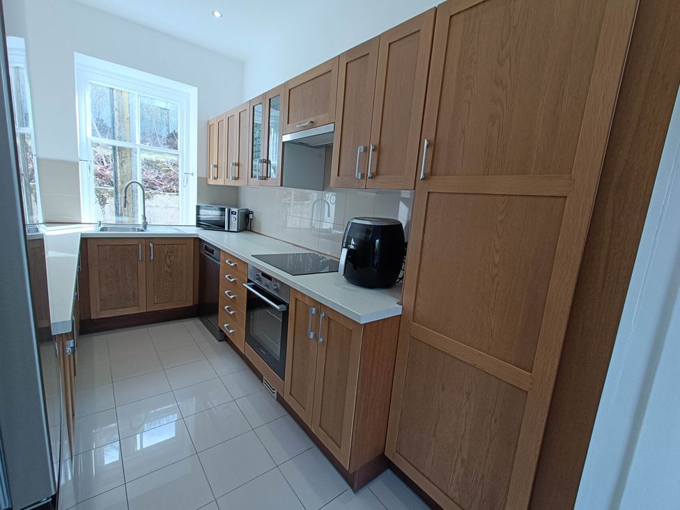 A kitchen with cabinets and appliances at RnB Rural n Beautiful Near Barrhill