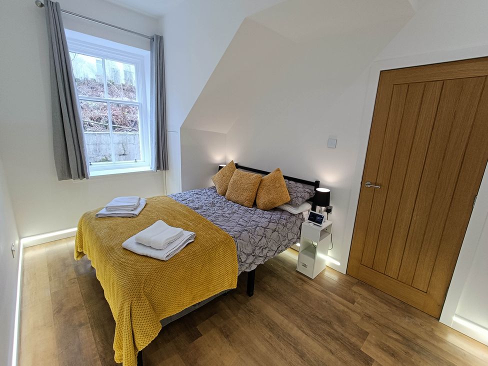 A bedroom with a bed and window at RnB Rural n Beautiful Near Barrhill