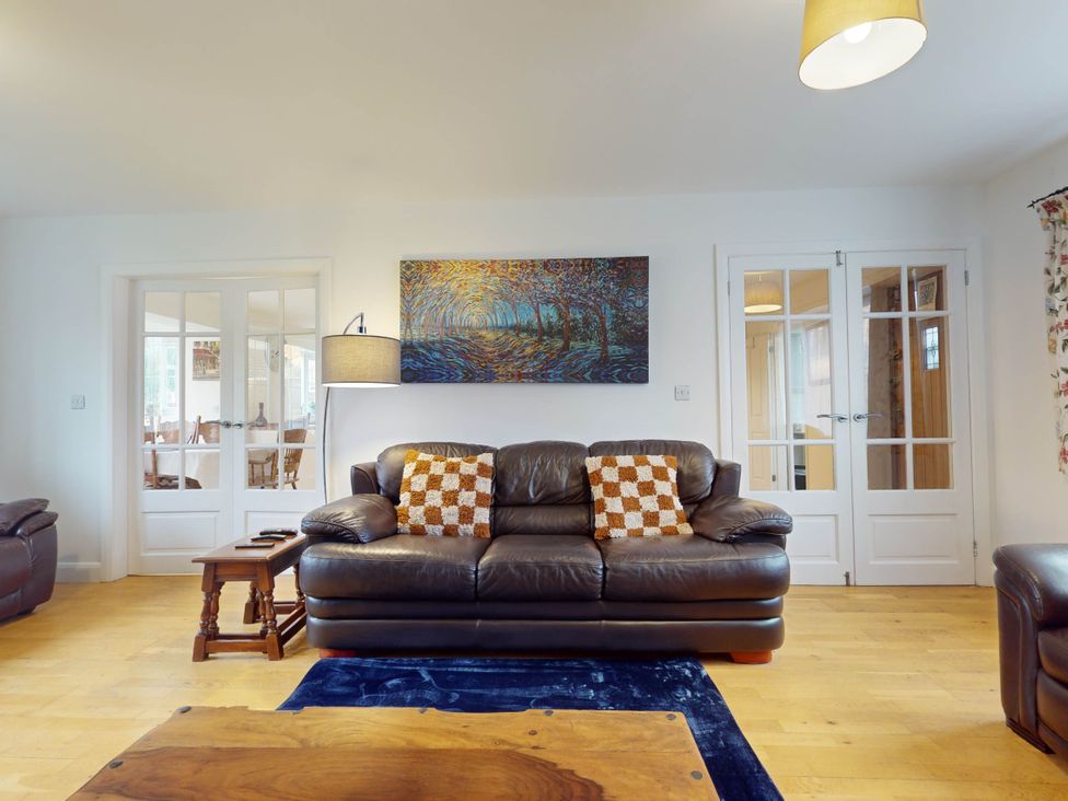 A living room with a sofa and coffee table at 5 Bedroom Home Sleeps 16 Ideal for Groups in Epworth