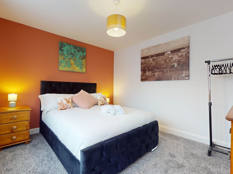 A bedroom with a bed and bedside table at 5 Bedroom Home Sleeps 16 Ideal for Groups in Epworth