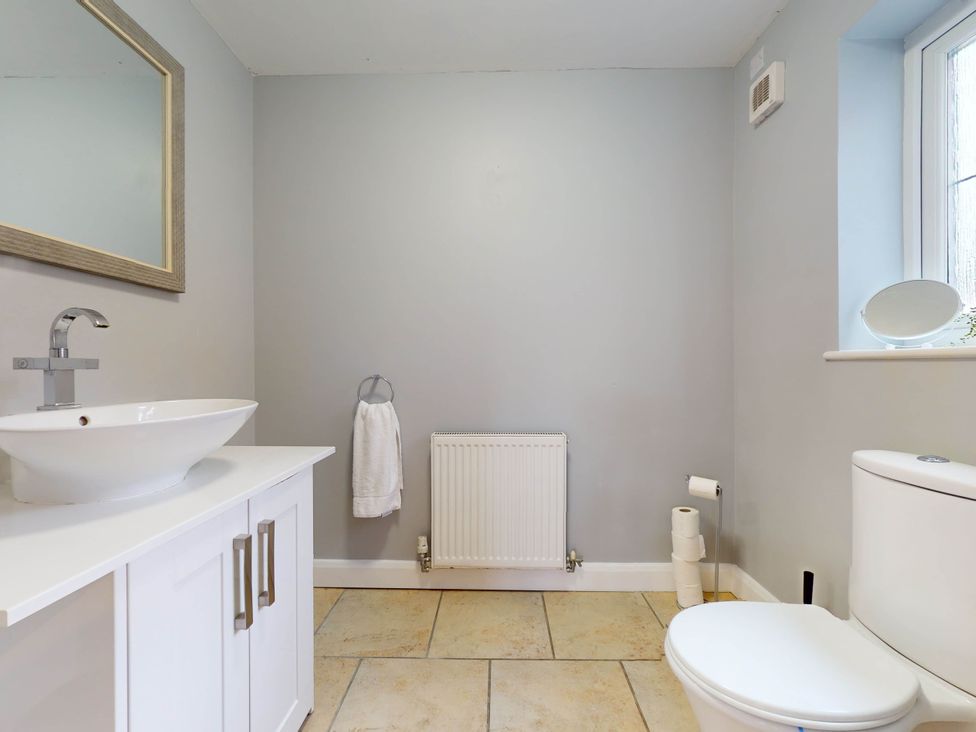 A bathroom with a sink and toilet at 5 Bedroom Home Sleeps 16 Ideal for Groups in Epworth