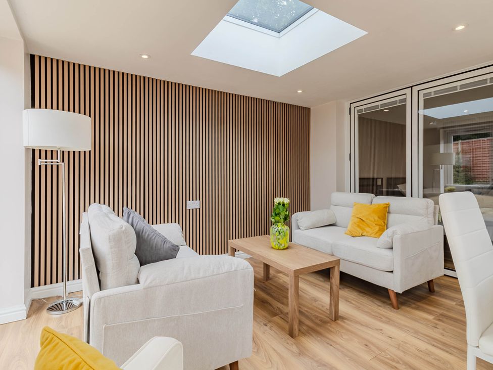 A living room with a sofa and coffee table at Loughborough Luxe Bungalow Retreat Sleeps 6 Shepshed