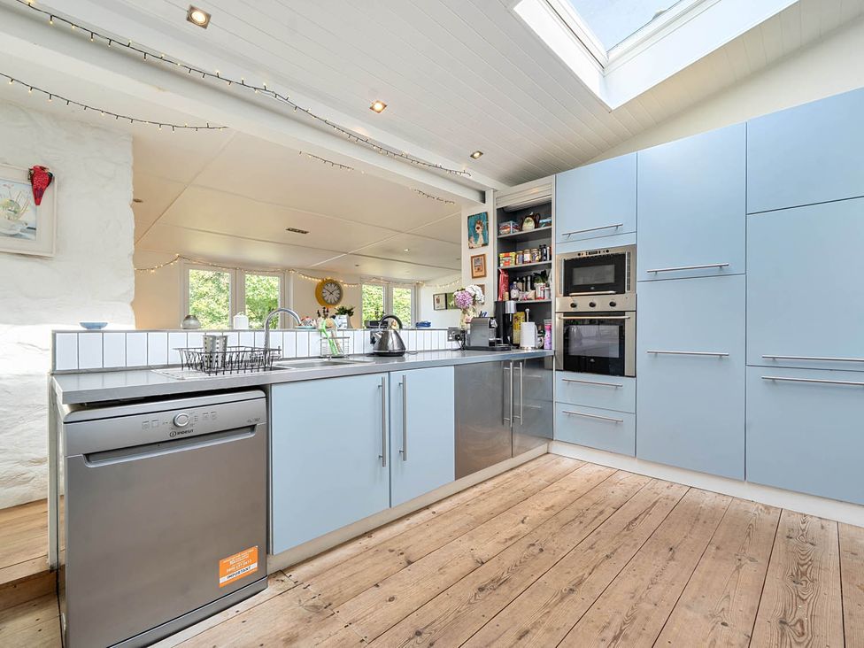 A kitchen with a dishwasher and sink at House Sleeps 6 Pet Friendly Parking Auchencairn near Palnackie