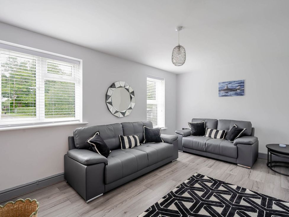 A living room with gray sofas and a coffee table at Detached House in Quiet Village Pets Allowed Ashbocking near Otley, Suffolk