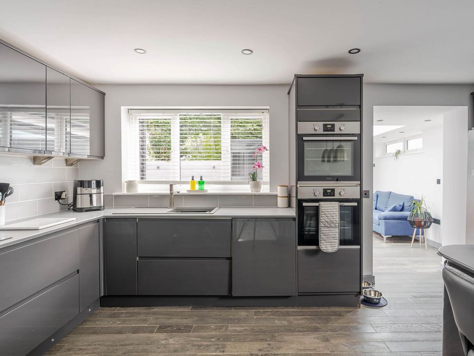 A kitchen with ovens and a sink at Detached House in Quiet Village Pets Allowed Ashbocking near Otley, Suffolk