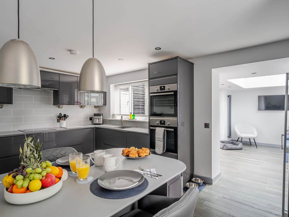 A kitchen with a table set for breakfast at Detached House in Quiet Village Pets Allowed Ashbocking near Otley, Suffolk