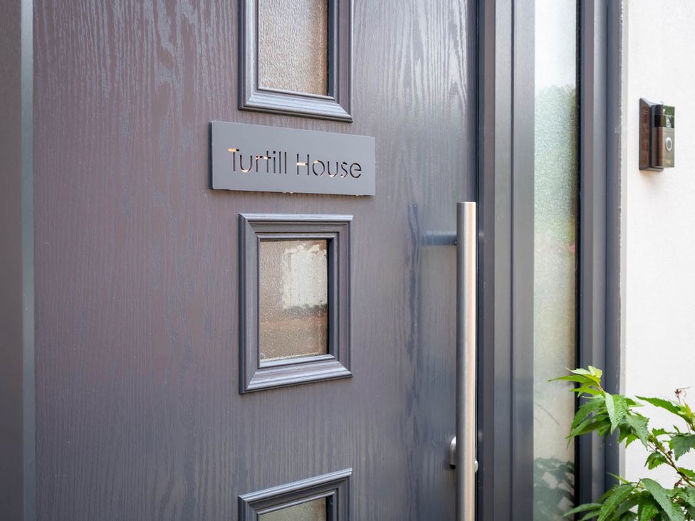 A front door with a name sign at Turtill House in Ashbocking near Otley, Suffolk