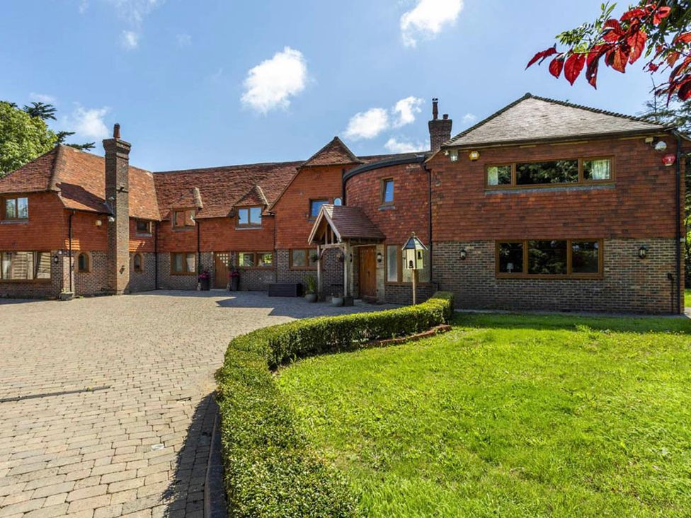 A house with a driveway and garden at Sleeps 10 to 18 Parking Garden Pool Hot Tub Balcony in Friston