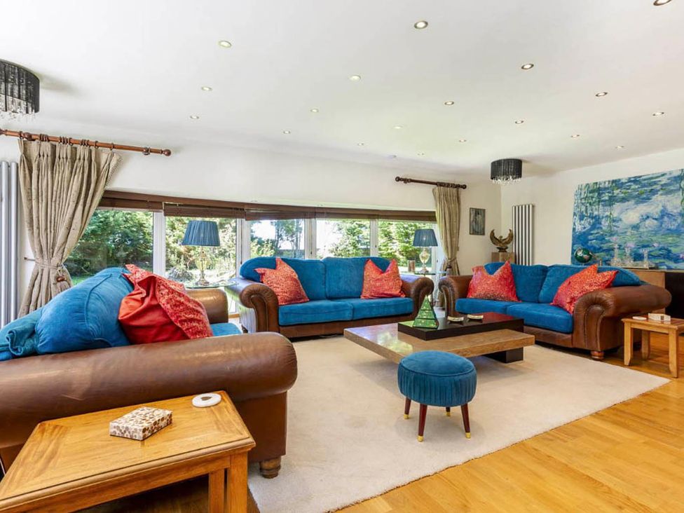 A living room with sofas and a coffee table at Sleeps 10 to 18 Parking Garden Pool Hot Tub Balcony Friston