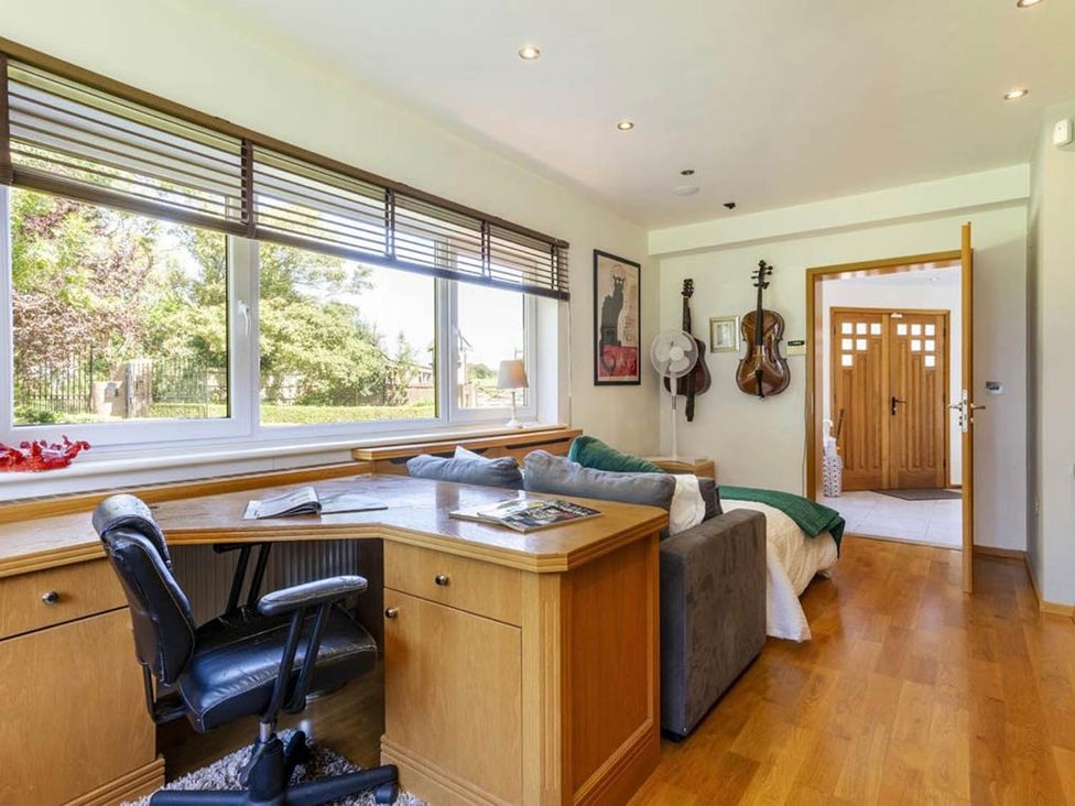 A home office with a desk and guitars at Sleeps 10 to 18 Parking Garden Pool Hot Tub Balcony Friston