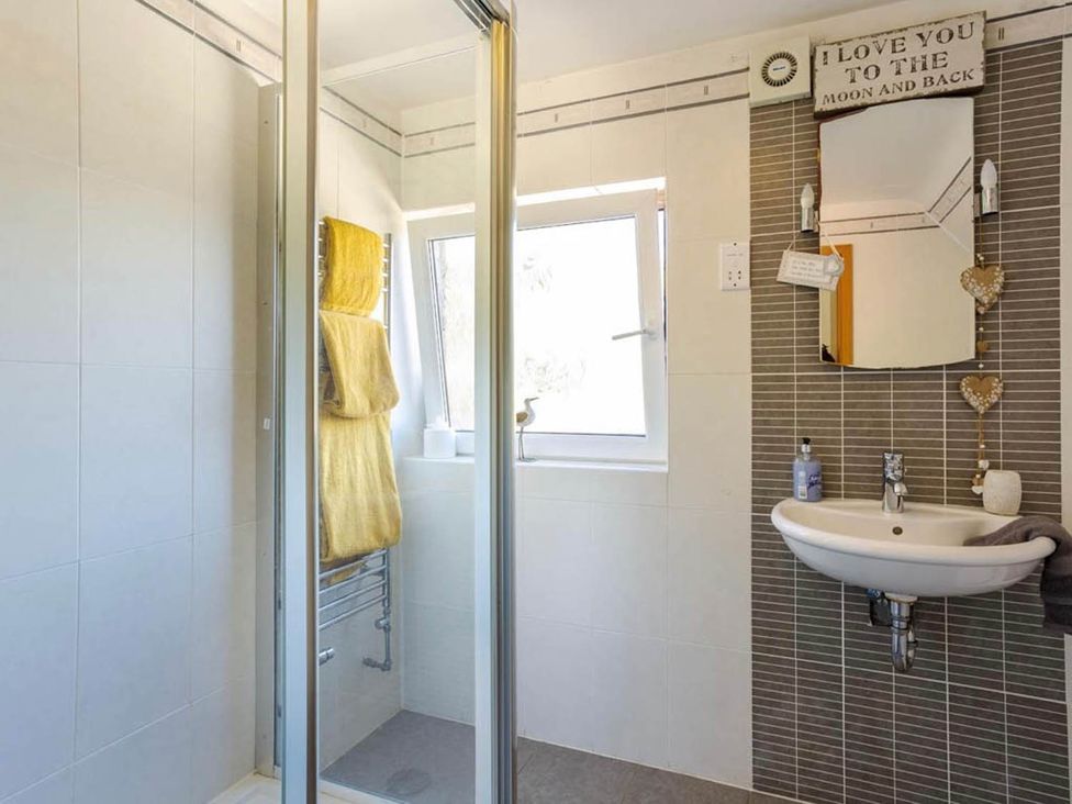 A bathroom with a shower and sink at Sleeps 10 to 18 Parking Garden Pool Hot Tub Balcony in Friston