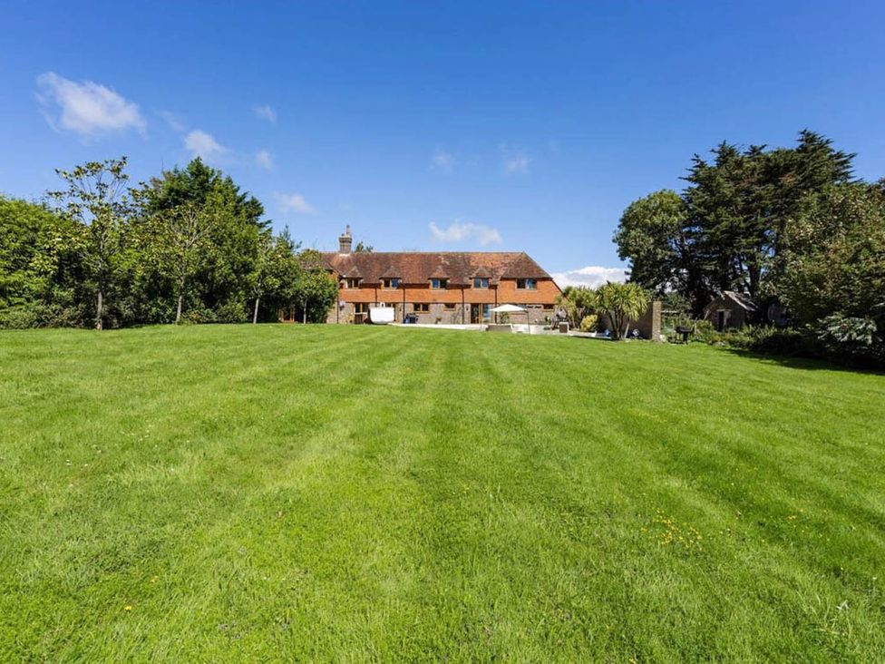 A house with a large garden area at Sleeps 10 to 18 Parking Garden Pool Hot Tub Balcony in Friston