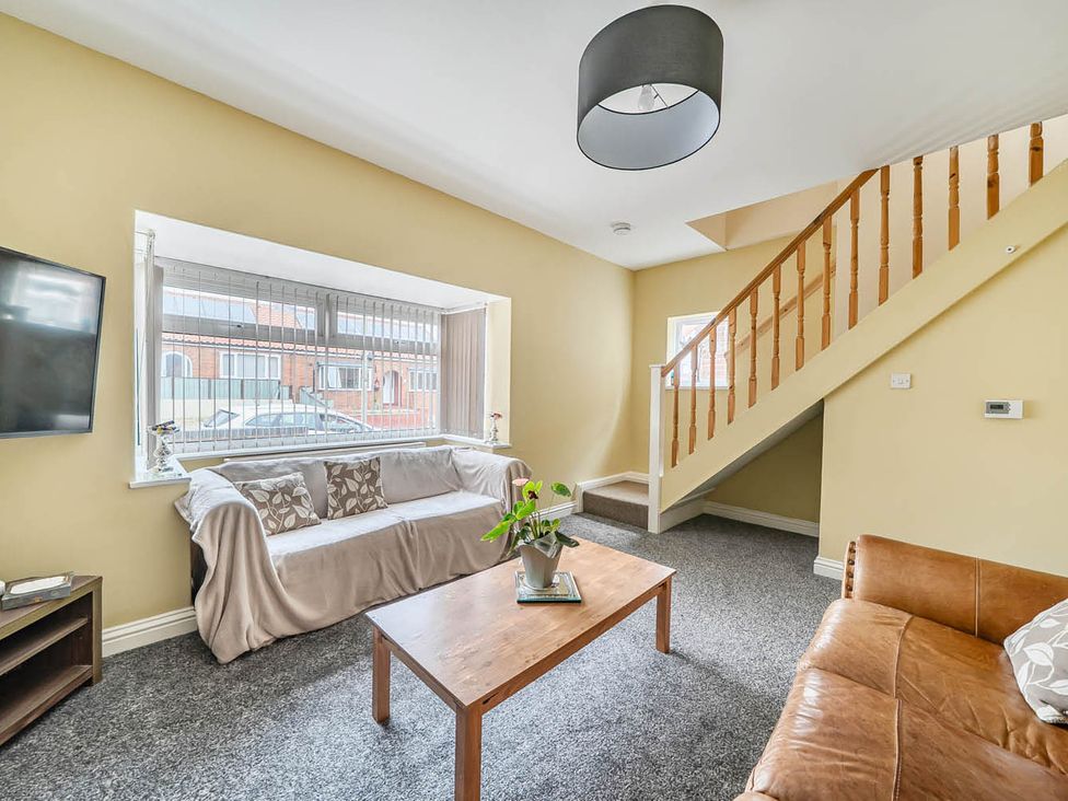 A living room with a sofa and a coffee table at Cottage Sleeps 6 with Parking and Garden Bridlington