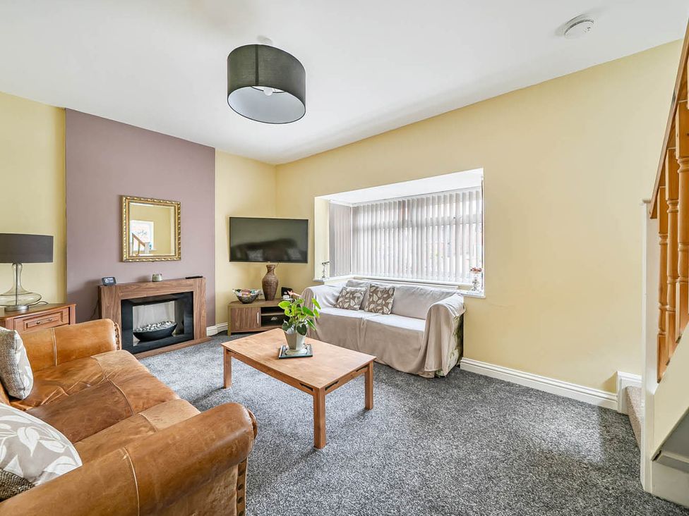 A living room with a sofa and coffee table at Cottage Sleeps 6 with Parking and Garden in Bridlington