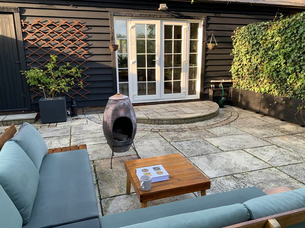An outdoor seating area with a sofa and table at the property