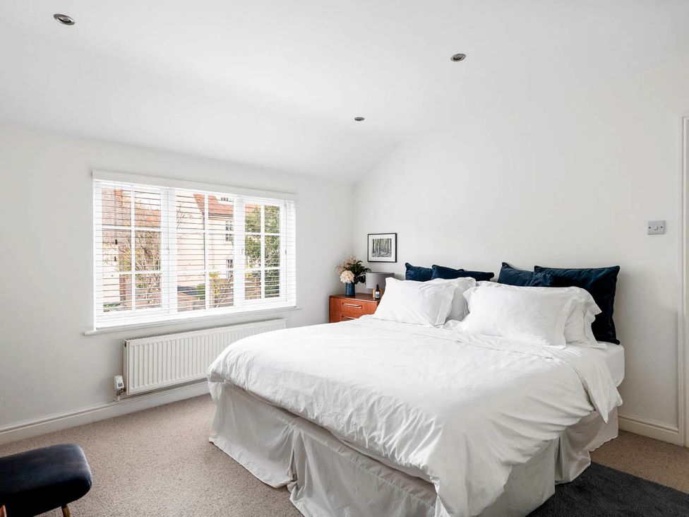 A bedroom with a bed and window at the property