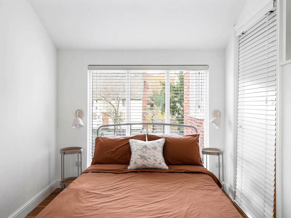 A bedroom with a bed and window at 