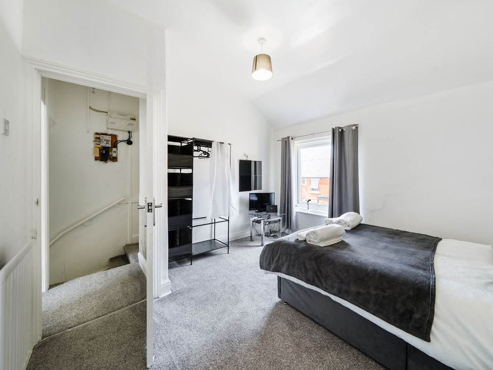 A bedroom with a bed and television at undefined in undefined