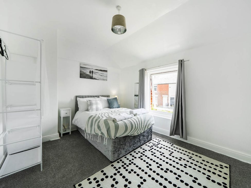 A bedroom with bed and window at the property in unspecified location