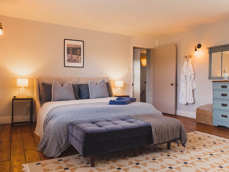 A bedroom with a bed and nightstand at the property in an unknown location