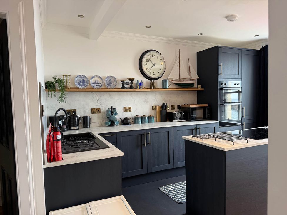 A kitchen with a stove and oven at the property in 